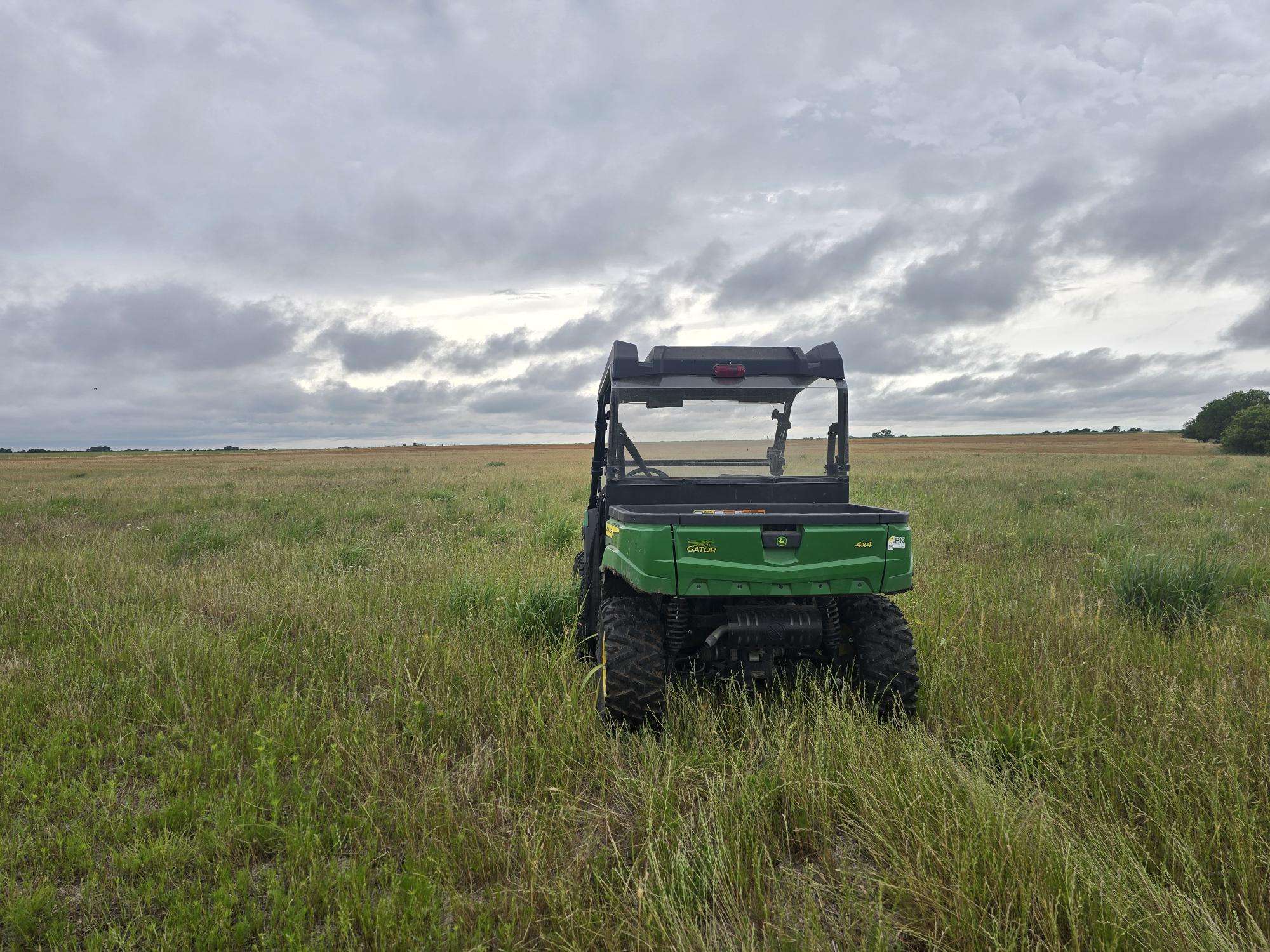 Rainmaker Farm gator in a wheat field during the 2026 Q2 Impact Report